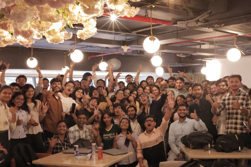 All 150+HackItBros '26 builders cheering together with hands up